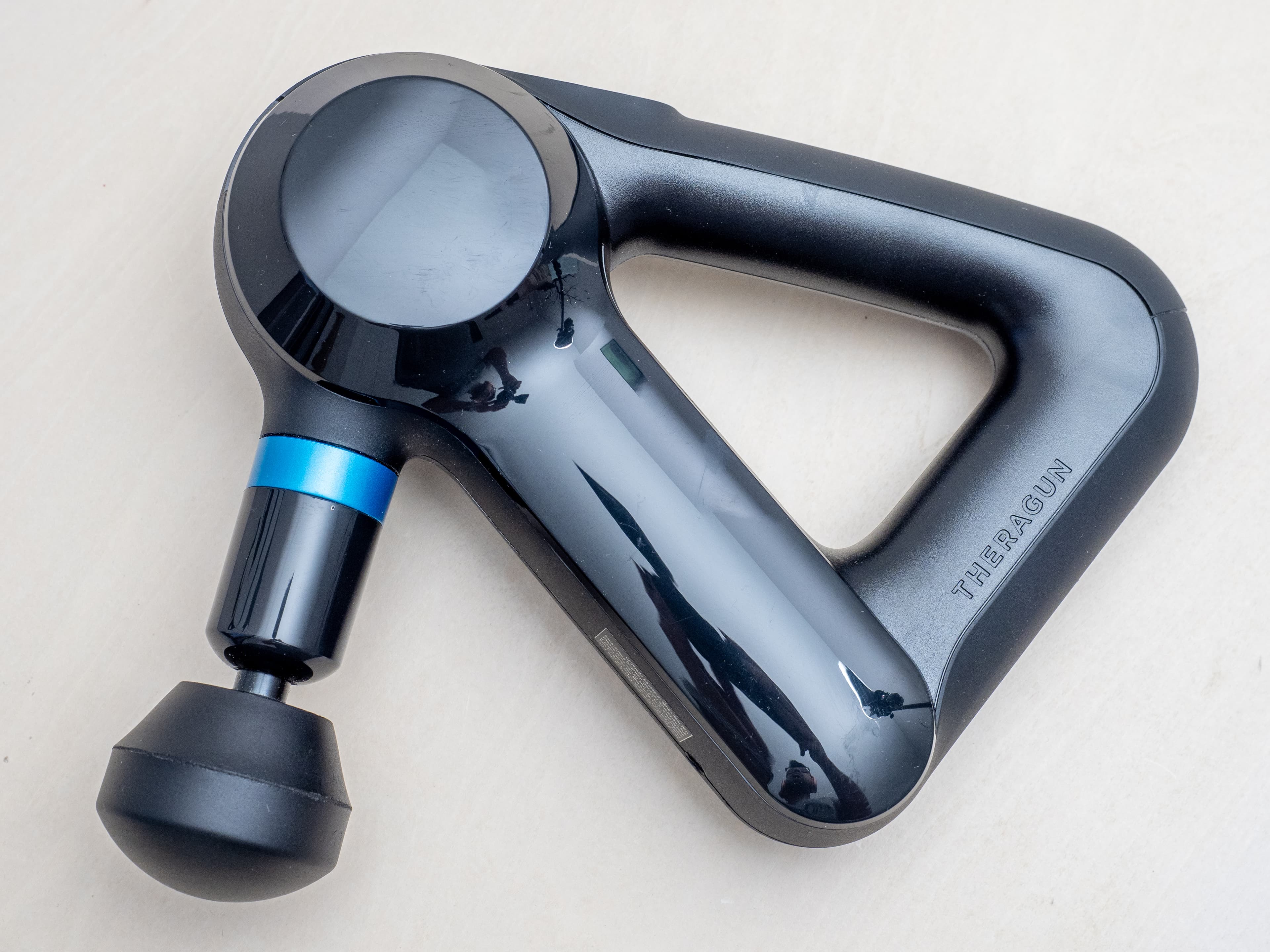 Theragun massage gun product photo.